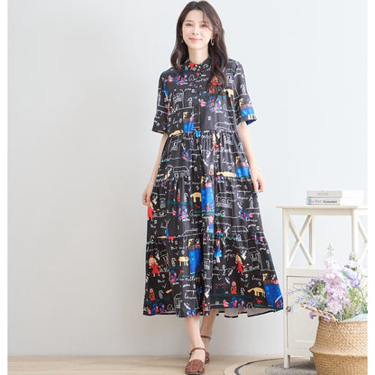 個性的なキャラクターや建物が描かれたポッププリントのティアードワンピース