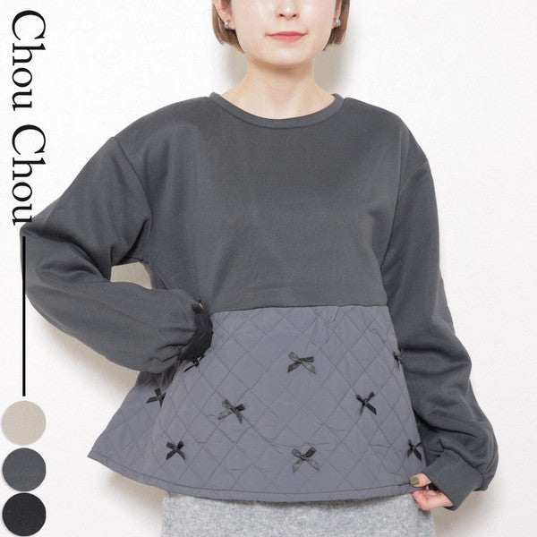 ゆったりシルエットのブラック裏起毛トップスを着用した女性（前面）