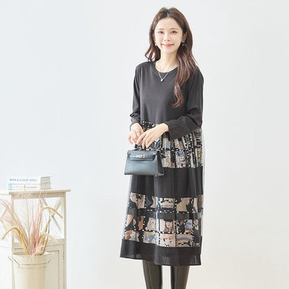 Mikonosublue Storeの異素材切替ロングワンピース。黒の無地トップスとアートなコラージュ柄スカートのドッキングデザイン。