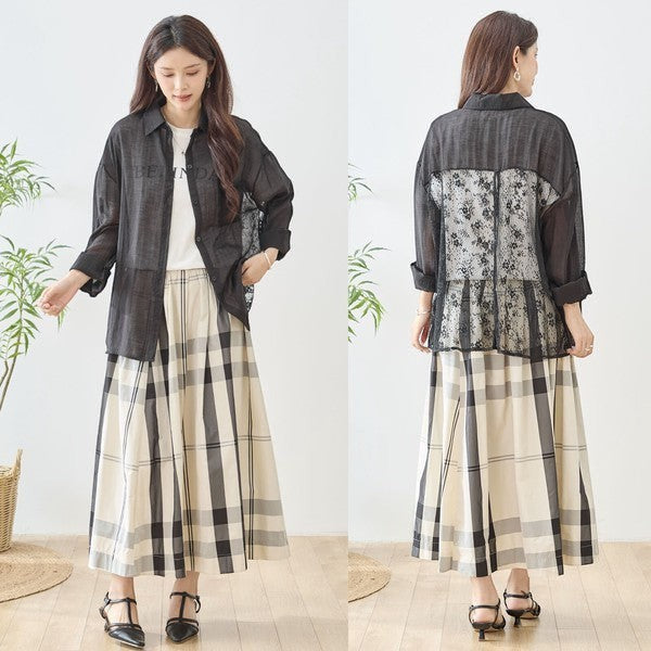 Mikonosublue Store black sheer long sleeve blouse with floral lace panel on back and chest pocket, worn by a woman with a plaid skirt.