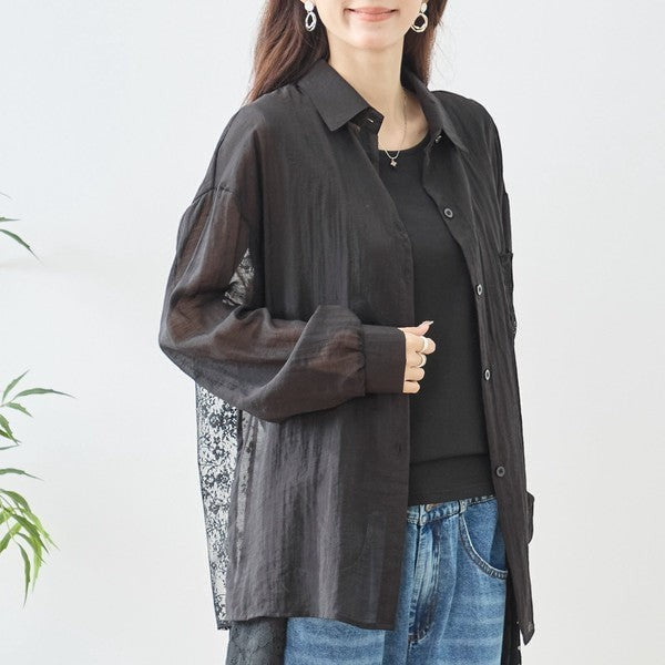 Mikonosublue Store black sheer long-sleeve blouse with floral lace paneling and relaxed fit.