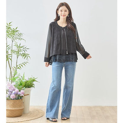 Mikonosublue Storeの黒いシアーレースジャケット。フラワーカットワークとパールボタンが特徴のバックロング丈ライトアウター。