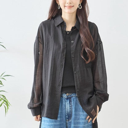 Mikonosublue Store black sheer long-sleeve shirt with floral lace details and a relaxed fit, perfect for layering.