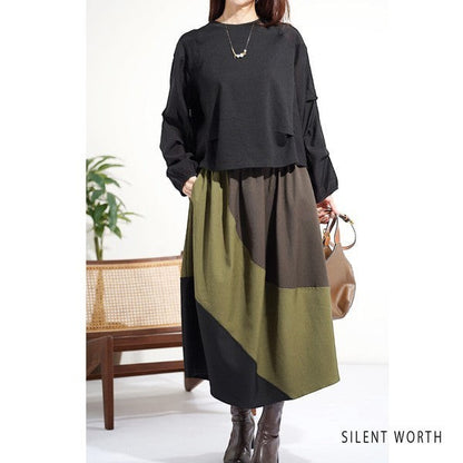 Mikonosublue Store black long-sleeve pullover with voluminous tuck sleeves and mixed fabric design on a model