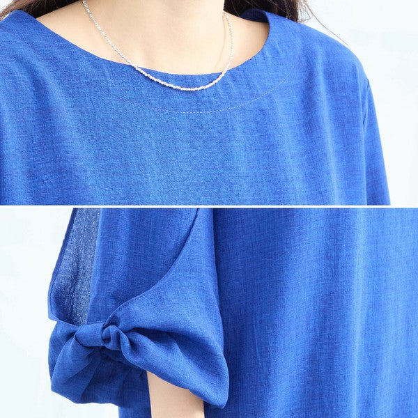 Mikonosublue Storeの青い袖リボン付きチュニックワンピース。ゆったりとしたAラインシルエットで体型カバーも叶うフェミニンなデザイン。