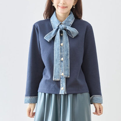 Mikonosublue Storeのデニム切替ボウタイ付きネイビーカットソーカーディガン。異素材ドッキングでゆったりとしたシルエットの大人可愛いトップス