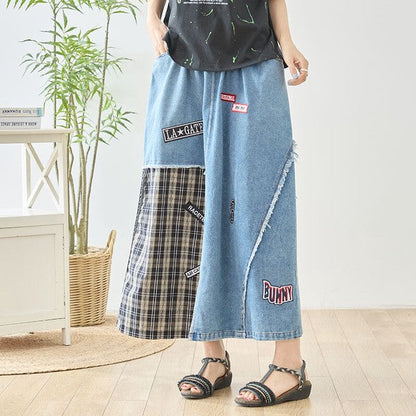 Mikonosublue Storeのデニムとチェック柄を組み合わせたパッチワークマキシスカート。ワッペンとフリンジが特徴のリメイク風デザイン