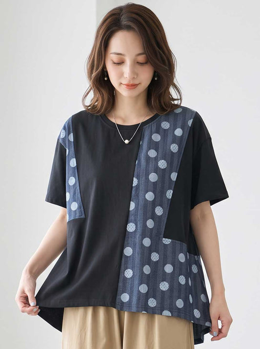 Mikonosublue Storeのドット柄と無地の異素材切り替えが特徴的なブラックの半袖トップス。ゆったりとしたAラインシルエットで体型カバーも叶うデザイン。