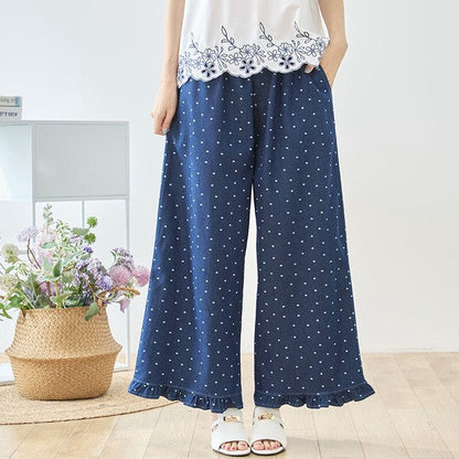 Mikonosublue Storeのドット柄デニムワイドパンツ。裾フリルが特徴の綿100%ネイビーのゆったりとしたパンツ。