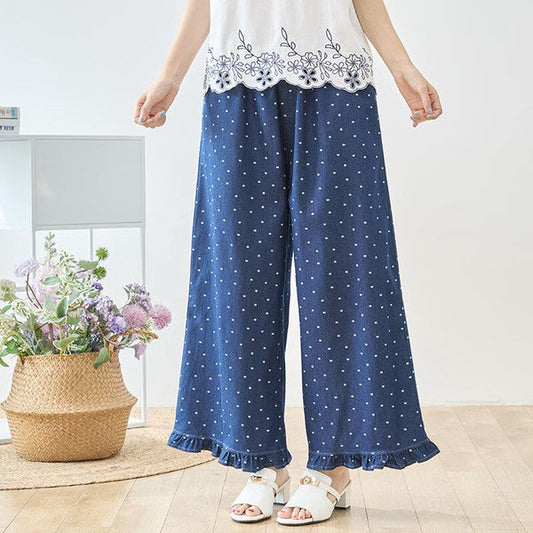 Mikonosublue Storeのドット柄デニムワイドパンツ。裾フリルとウエストゴムで体型カバーも叶う綿100%の大人可愛いネイビーパンツ。