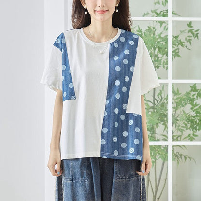 Mikonosublue Storeの無地とドット柄を組み合わせたアシンメトリーな異素材切り替え半袖トップス。ゆったりとしたAラインシルエットで体型カバーも叶うコットン素材の夏用カットソー