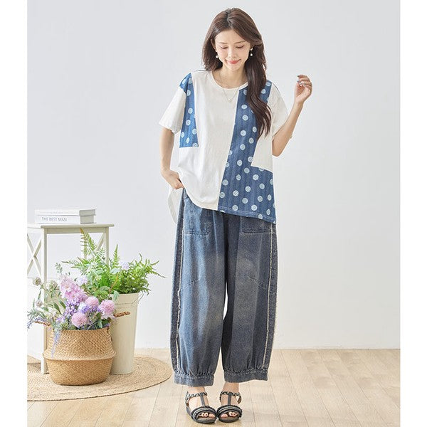 Mikonosublue Storeのドット柄と無地の異素材切り替え半袖トップス。ゆったりとしたAラインシルエットで体型カバーも叶う夏用カットソー