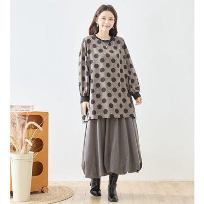 Mikonosublue Storeのドット柄チュニックプルオーバー。ボリューム袖とゆったりしたシルエットが特徴の大人可愛い秋冬用長袖トップス。