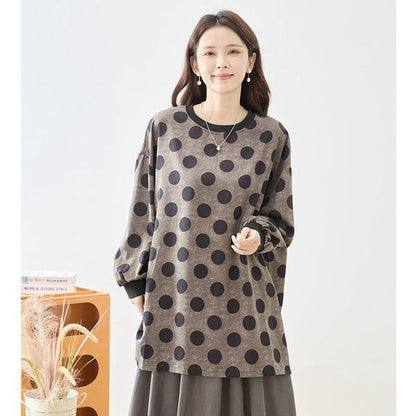 Mikonosublue Storeのドット柄チュニックプルオーバー。ボリューム袖とリブ切り替えが特徴のゆったりとしたオーバーサイズシルエット。
