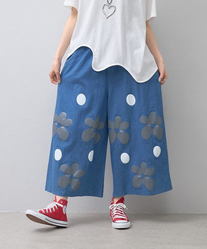 Mikonosublue Storeのフラワーとドット柄がプリントされたデニムライクな綿混ワイドパンツ