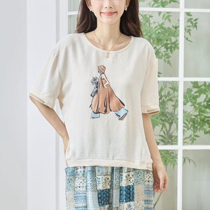 Mikonosublue Storeのファッションイラストがプリントされた、ゆったりとしたシルエットのベージュの半袖トップス