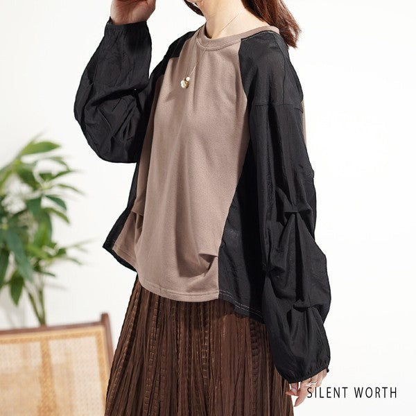 Mikonosublue Store taupe and black mixed-material pullover with voluminous raglan tuck sleeves and a loose fit.