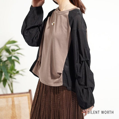 Mikonosublue Store taupe and black mixed-material pullover with voluminous raglan tuck sleeves and a loose fit.