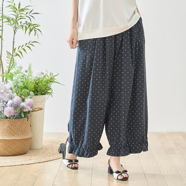 Mikonosublue Storeのピンドット柄ワイドパンツ。裾のギャザーフリルが特徴的なネイビーのゆったりとしたポリエステル製ボトムス。