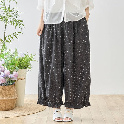 Mikonosublue Storeのピンドット柄ワイドパンツ。裾のギャザーフリルが特徴的な、ゆったりとしたシルエットのポリエステル製ボトムス。