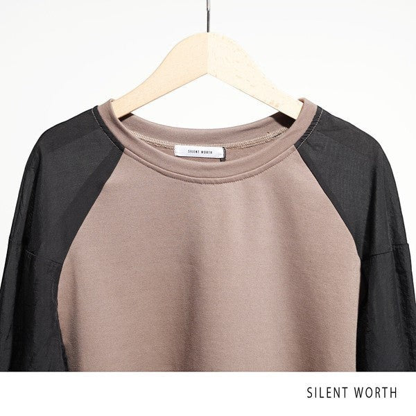Mikonosublue Store taupe and black raglan sleeve pullover with mixed material contrast and crew neckline