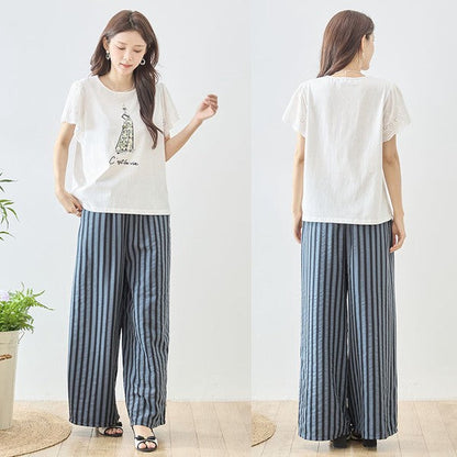 Mikonosublue Storeのストライプ柄ワイドパンツ。ウエストゴムでゆったりとした美脚シルエットのロングパンツ。