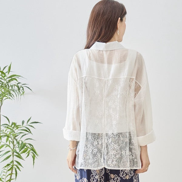 Mikonosublue Store white sheer long-sleeve blouse with floral lace paneling and a relaxed fit.