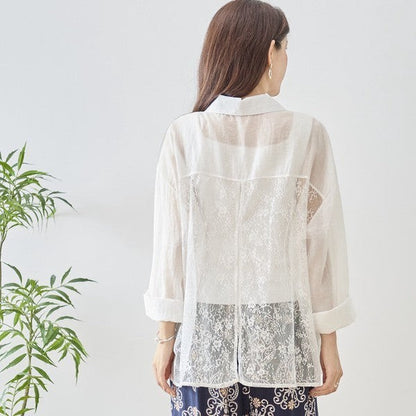 Mikonosublue Store white sheer long-sleeve blouse with floral lace paneling and a relaxed fit.