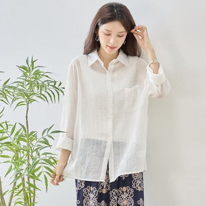Mikonosublue Store white sheer long-sleeve blouse with floral lace details and a relaxed fit.