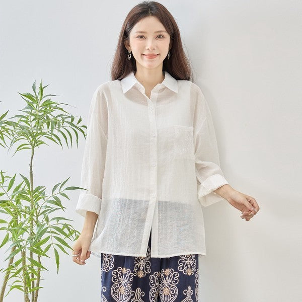 Mikonosublue Store white sheer long-sleeve blouse with floral lace details and a relaxed fit.