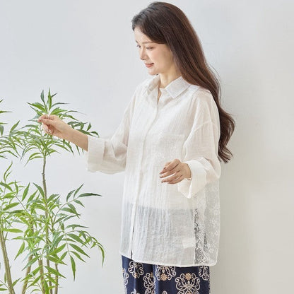 Mikonosublue Store white sheer floral lace panel long sleeve shirt blouse with a relaxed fit.